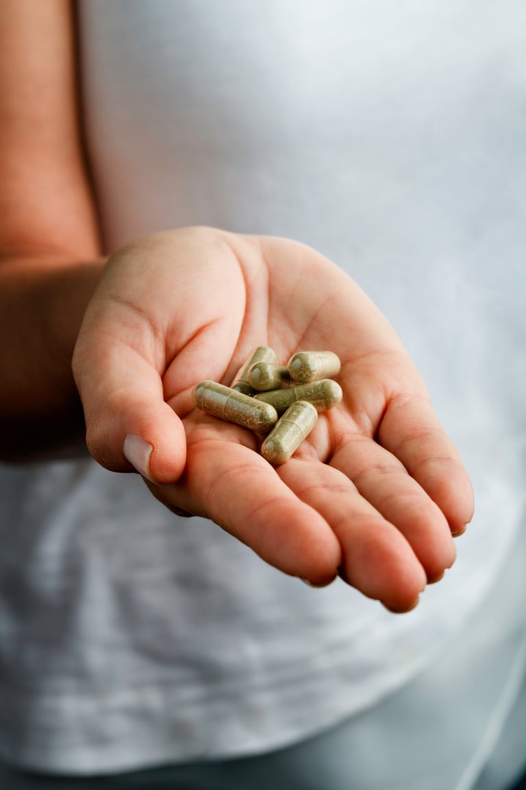 Female hand with nutritional supplements